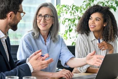 Group-of-people-discussing-financial-plan-at-boardroom-meeting